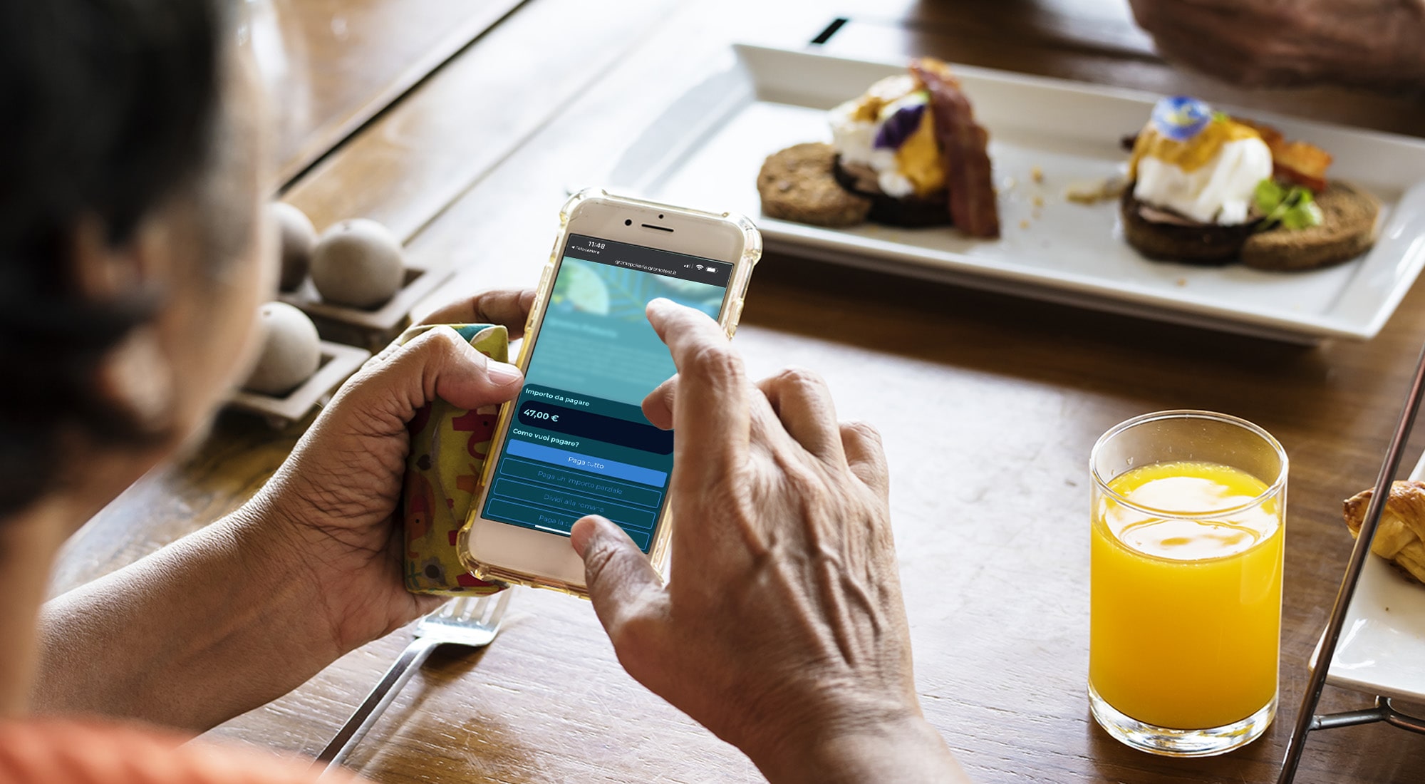 Customer leaving a tip from their smartphone with Qromo Pay the Bill